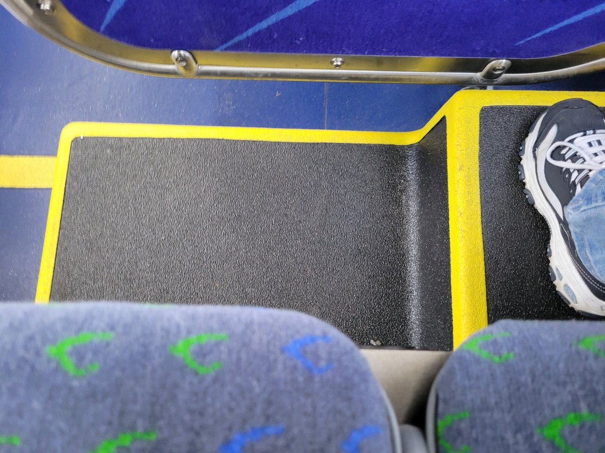 My bus has that new bus smell, but I haven't figured out what this little step thing is in this row of seats. I'm sure one day I'm going to manage to tumble off of it when standing to get off the bus.