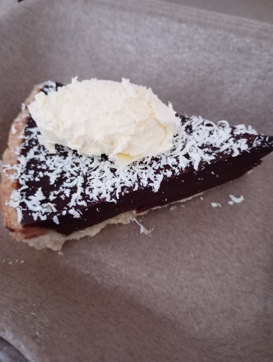 Rich dark chocolate tart with clotted cream.