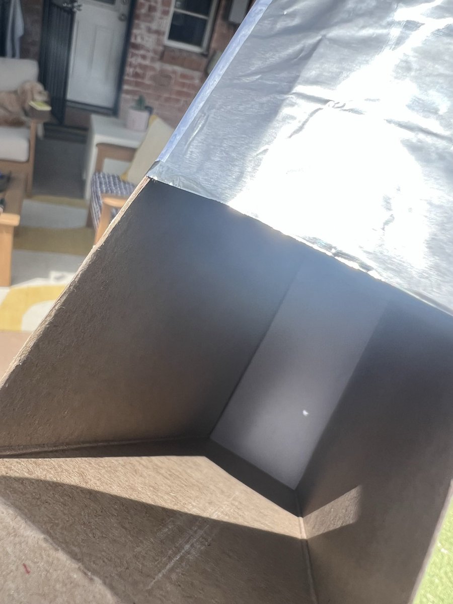 madscientistA2's tweet photo. Wasn’t in the path of totality (but my parents were!!! #clevelandisthereason) but I DID jerryrig a cereal box eclipse viewing portal at the last second to catch those partial solar eclipse views in my Tucson backyard https://t.co/rCILiiYeth