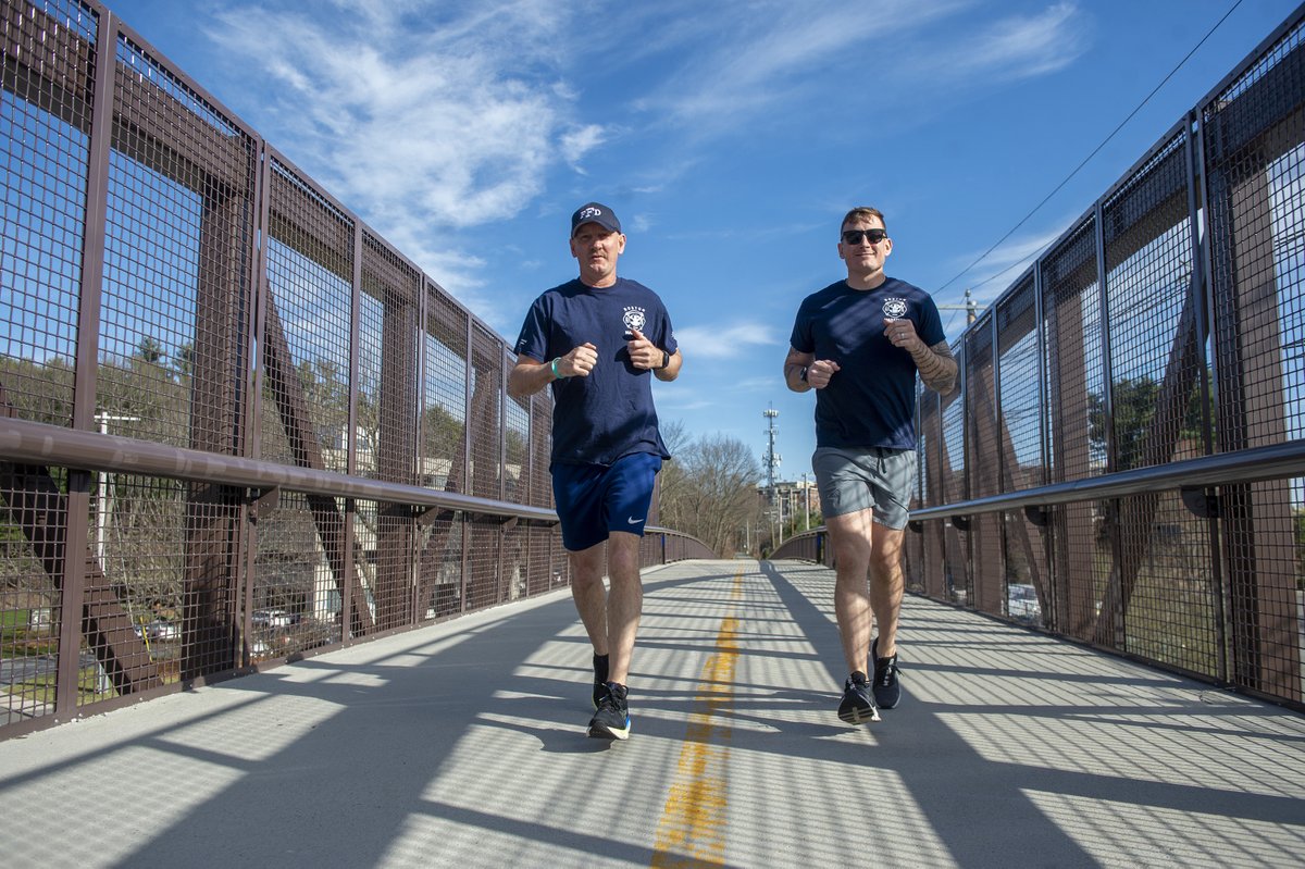 Boston Marathon runners Framingham Asst Fire Chief John Schultz, and FF Josh Prouty on the Cochituate Rail Trail Bridge, April 9, 2024. Schultz is running for Jewish Family Services. Prouty is running for the MetroWest ESL Fund. @metrowestdaily @FraminghamFire @BAA