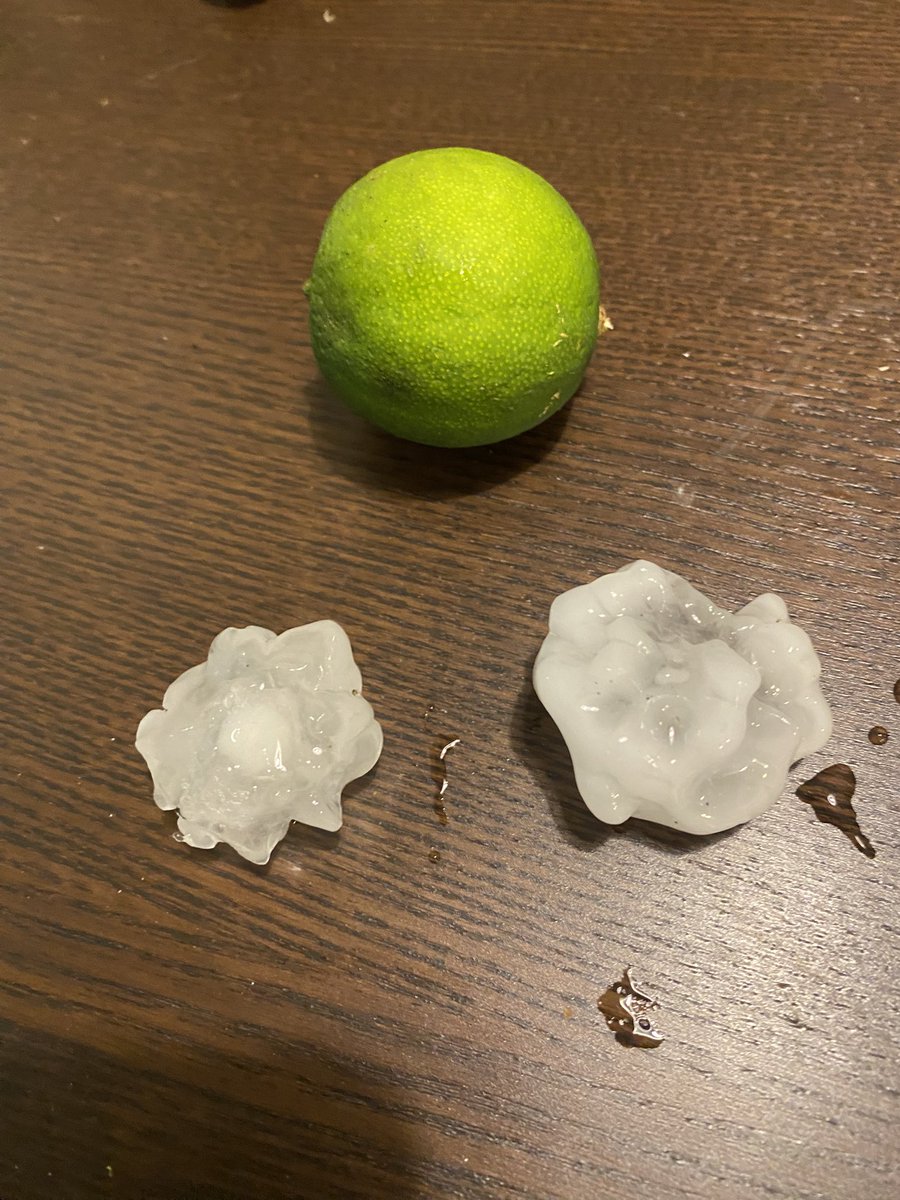 A few hail specimens from a strong storm that just blew threw North Austin (Anderson & Lamar area). Lime for scale