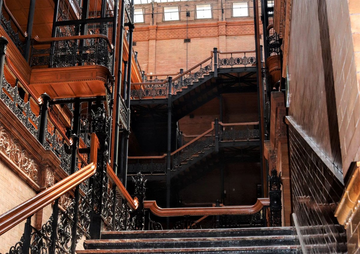 The Bradbury Building, located in Los Angeles, is an architectural landmark. Constructed in 1893 by architects Summer Hunt and George Wyman, this building  has been featured in fictional works and has been a popular filming location for movies, television shows, and music videos.