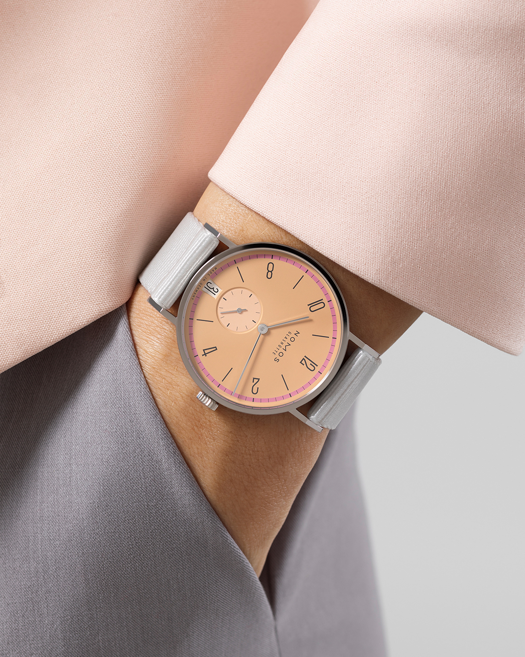 NOMOS Glashutte on X Tangente date Pastell is reminiscent of powder dried roses and the thread used in haute couture ateliers. A delicate watch that can be combined particularly well with vintage