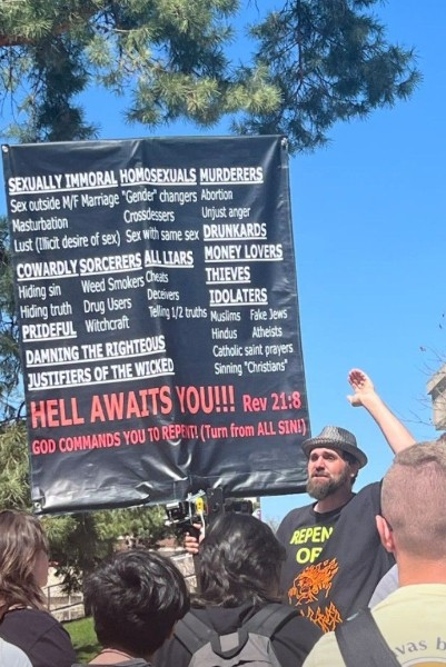 Javadog's tweet image. This idiot showed up at my daughter's university campus today. I guess he was pissed he missed the rapture again.