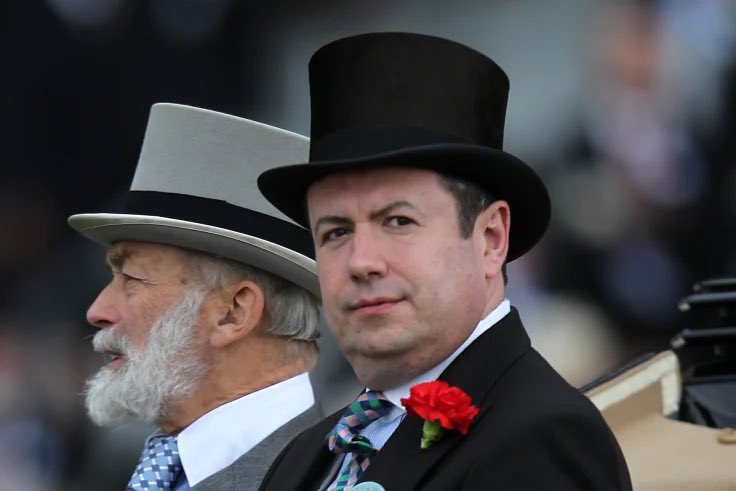 The Queen’s then Private Secretary, Sir Edward Young. Seen next to Prince Michael of Kent at Ascot.