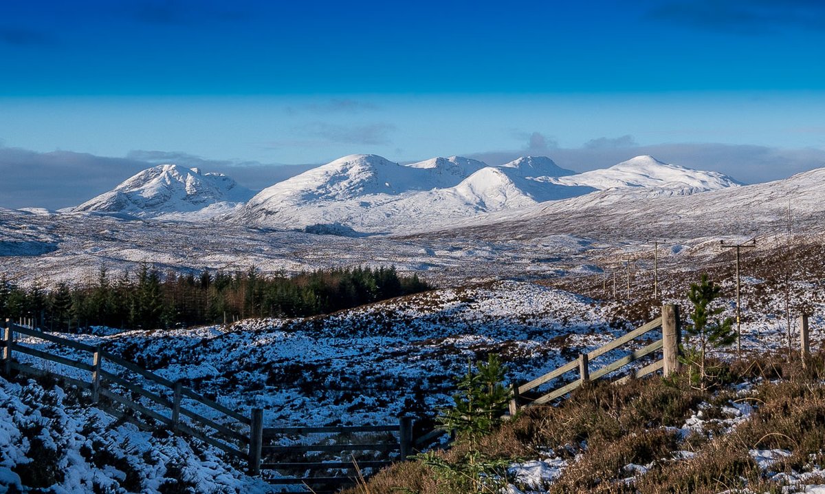 One from a while back. As you approach the top of Glen Docherty from Achnasheen, eyes are understandably looking straight ahead (especially if you're driving!) but If you glance to the left, you get your first view of some of the Torridon hills in the distance.