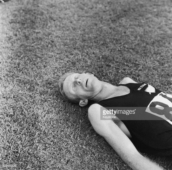 New Zealand runner Murray Halberg lays exhausted after winning the 5,000 metres gold medal in the Rome Olympics, September 1960.