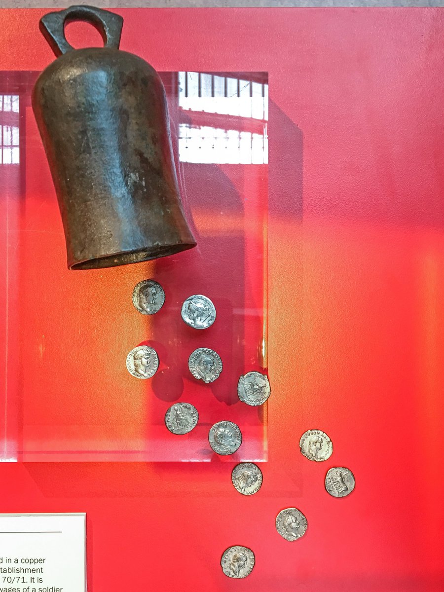 A hoard of twelve Roman denarii buried inside a bronze cowbell. The coins date from the age of Julius Caesar (46 BC) all the way up to the reign of Vespasian (AD 69-79) and were most likely concealed soon after this date in the late 1st century. The hoard was revealed by a farmer…