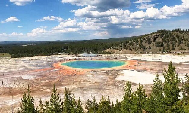 plumcandle's tweet photo. Yellowstone National Park, Wyoming

Midway Geyser Basin

The Midway Geyser Basin in Yellowstone National Park, while not home to the famous Old Faithful Geyser, is still arguably Yellowstone’s best area to explore, particularly for photographers. One reviewer states: “This is a must-see location within the park. The area is simply beautiful and very unique. The colors are truly magnificent.”  Due to those stunning colors, the Midway Geyser Basin is one of the most photographed walks in Yellowstone. It includes the Grand Prismatic Spring, the Excelsior Geyser, plus the Turquoise Pool and the Opal Pool. This tour is a good way to experience all these sites and more—led by an expert guide, you’ll be able to see several impressive geysers, along with the natural beauty of canyons, cascades and more.