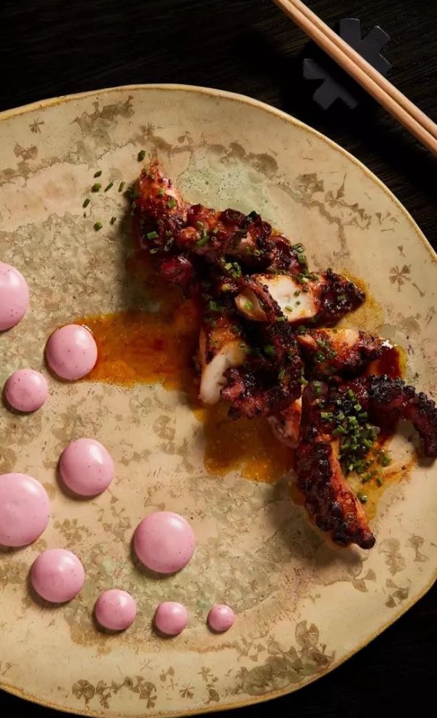 Mouth watering slow cooked octopus until soft and tender, then grilled to caramelise the edges, brushed with Peruvian chilli sauces next to a blueberry and yuzu juice emulsion