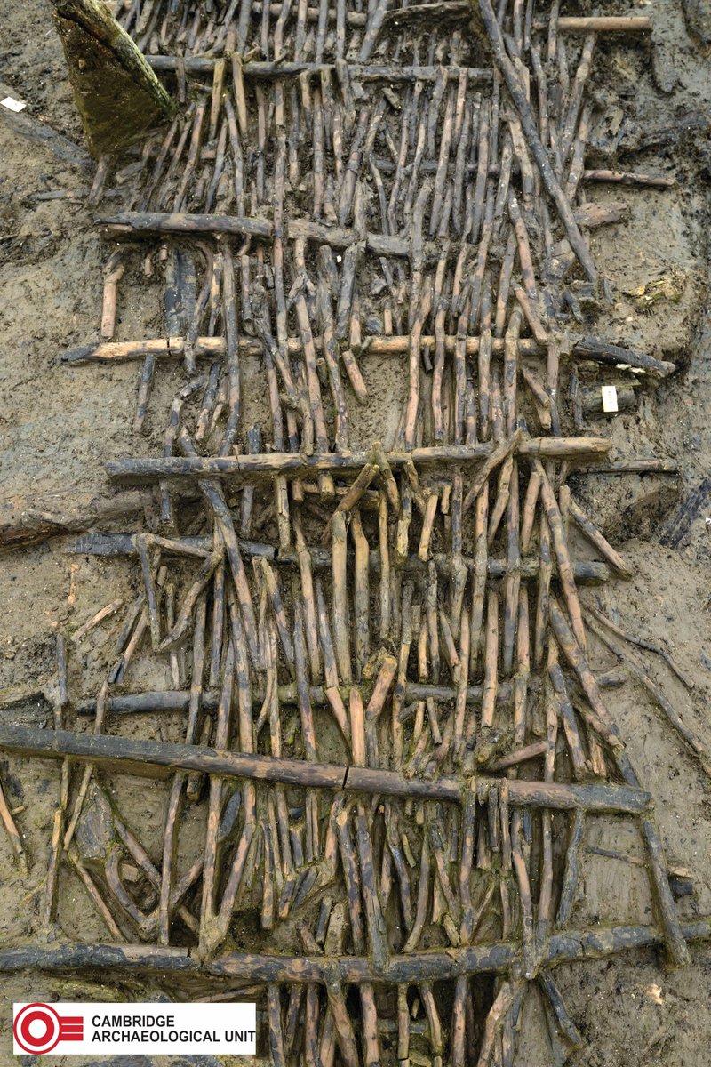 In the middle of the Must Farm settlement a well-preserved central walkway was discovered. This hurdle panel, made from hazel using an under-over weave with a more complicated plait in its centre, spanned gaps between structures allowing people to move around the settlement.