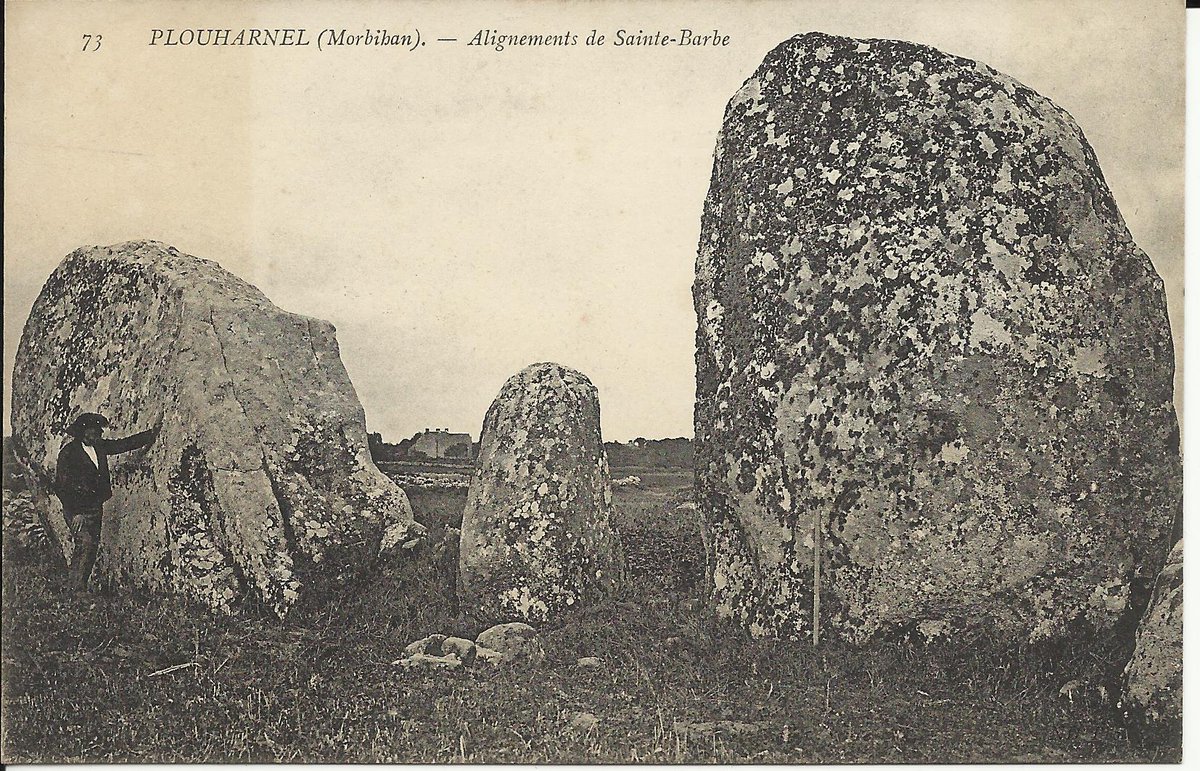 The alignments near Ste-Barbe in Plouharnel (Morbihan) originally comprised at least 8 rows running for 500m. Now only about 40 menhirs survive scattered through the fields. These are two of the biggest ones plus a smaller one. Card by Neurdein 1905 or earlier.