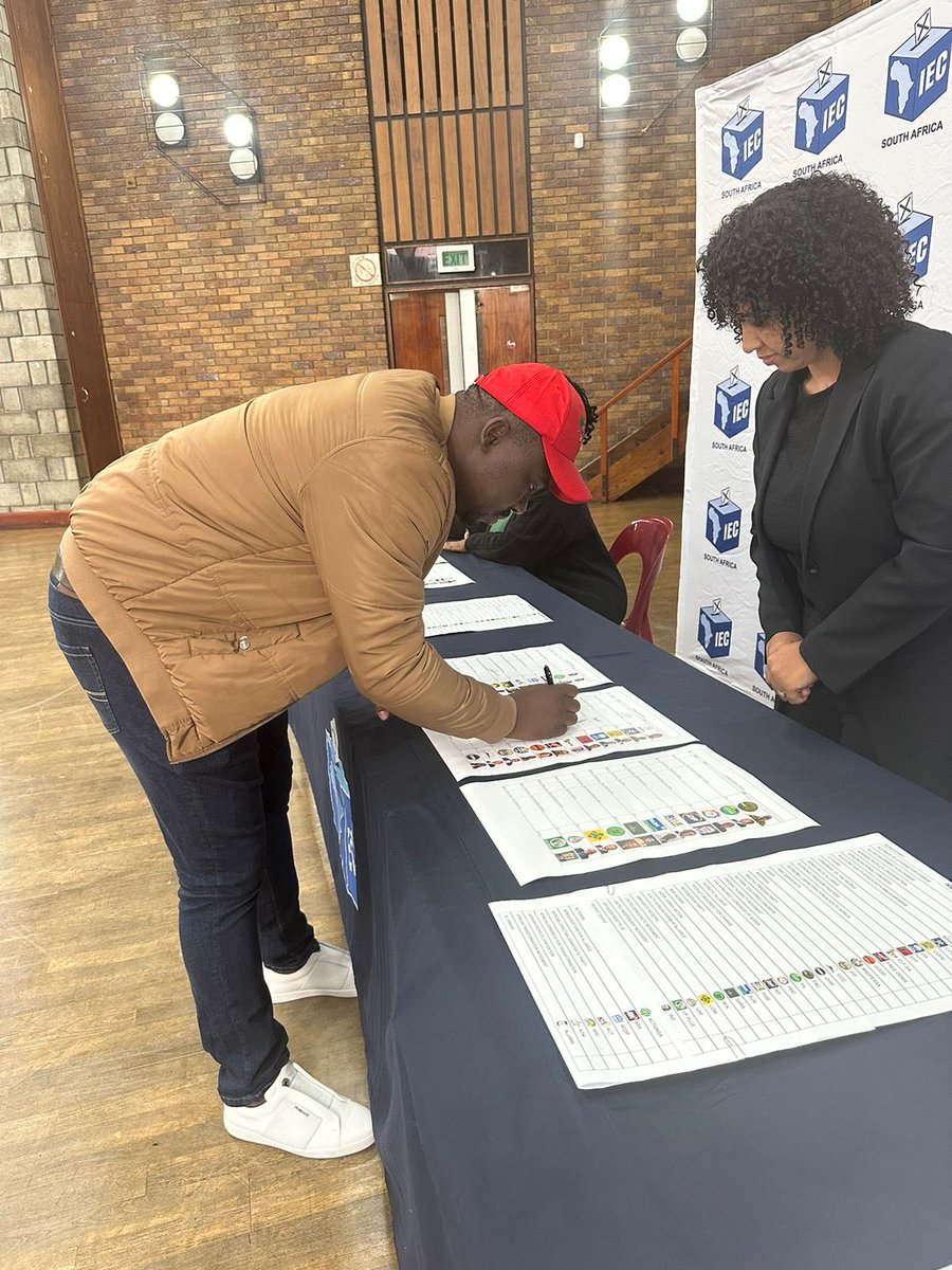 EFF Western Cape Provincial Secretary, Cmsr Magwala signing the IEC Regional and Provincial ballot papers earlier today.