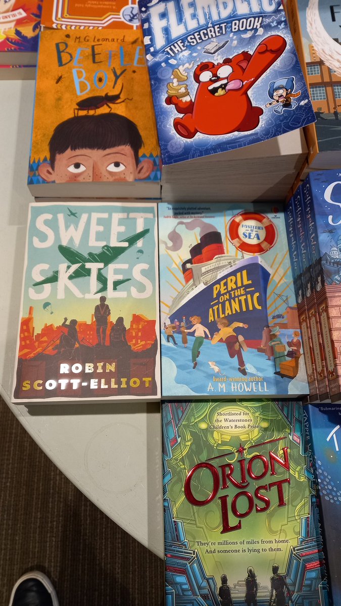 Newly signed copies of Finding Treasure Island & Sweet Skies looking good on the tables of @Waterstones_Edi fantastic children's/YA section @EveryWithWords @cranachanbooks