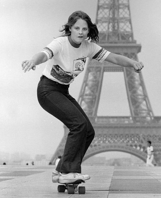 Jodie Foster rides a skateboard in Paris, 1970s.