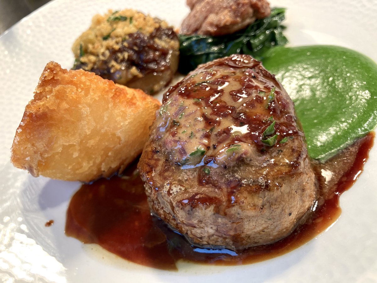 Veal fillet with Café de Paris butter, oxtail-stuffed onion and roast sweetbread