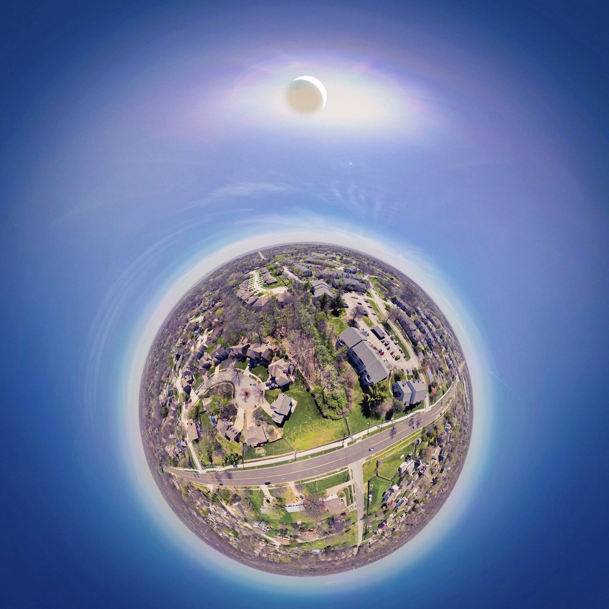 Just another random Solar Eclipse shot April 8, 2024 2:01pm over my casa. Captured at 200 ft., looking towards downtown KC. 0% moon, 8% sun, 92% eclipse. #djimini3pro #kansascity #globe #tinyplanet #spherualizer #panorama #tinyplanets #solareclipse #solareclipse2024
