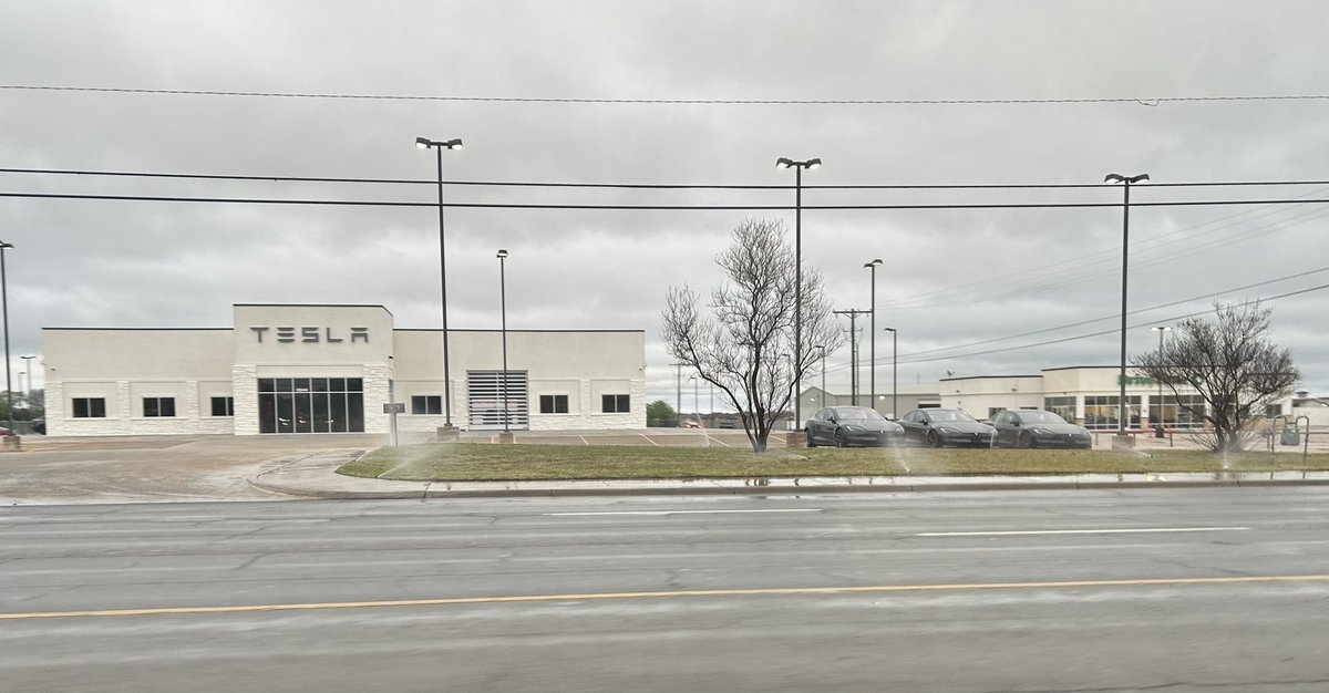 SimonKeiner's tweet photo. Leave it to a Tesla dealership to water their lawn in Lubbock TX after almost 2 inches of rain in that day… https://t.co/YCoQOuUkxj