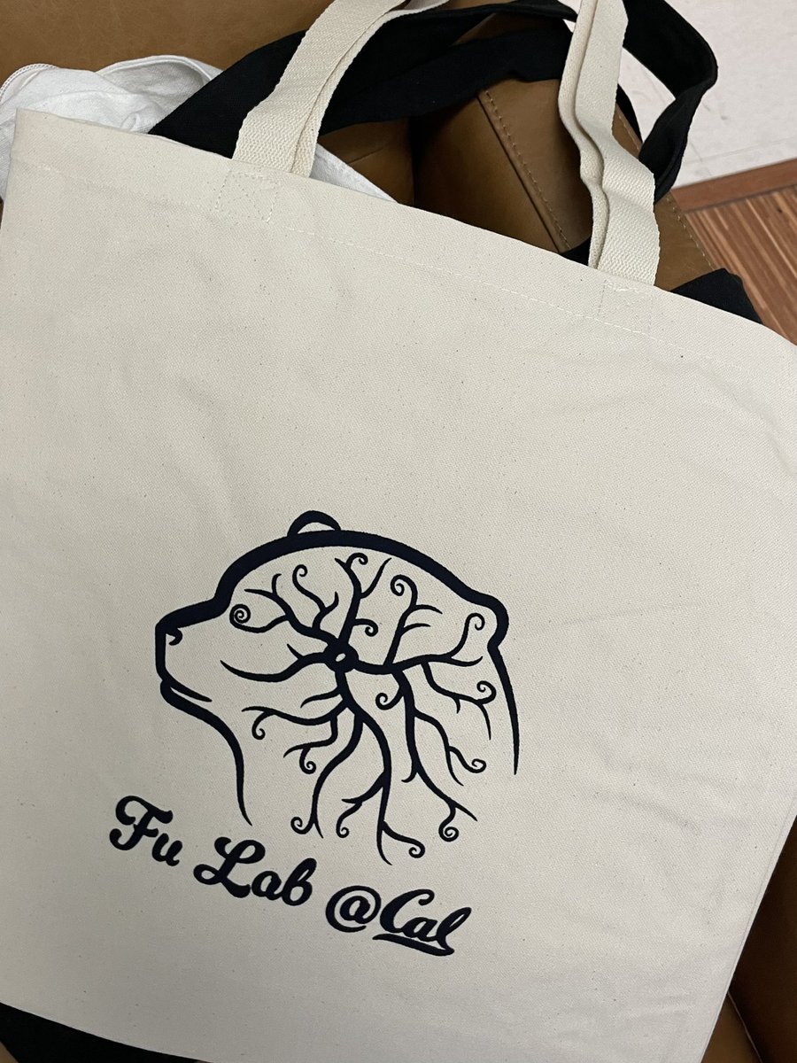 New lab logo! We screenprinted onto tote bags & hoodies this week 🤓 It’s a stylized oligodendrocyte inside a bear (Berkeley mascot). Eye is a spiral that resembles a myelin sheath cross section. Using a custom brush stroke, I traced an AI-generated bear head & drew the oligo.