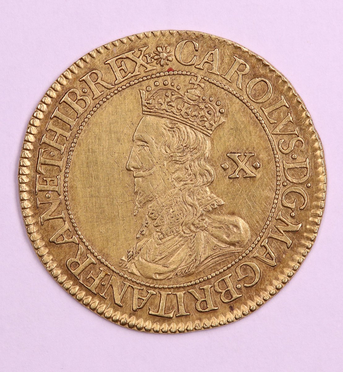 An English gold double crown of Charles I. It was engraved by and minted using machinery designed by Nicholas Briot between 1631 & 1632. Only a small number of machine-made coins were struck for circulation in England during Charles I’s reign. From @NtlMuseumsScot’s collection.