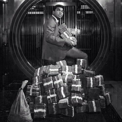 Muhammad Ali with his winnings in 1974.
