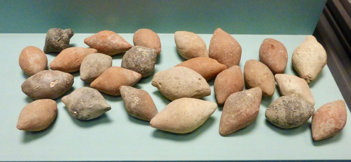 Some #Roman clay sling bullets from Paestum & lead sling bullets in the Osuna Museum in Spain. Work at #Burnswark in Dumfriesshire by @TrimontiumTrust and Dumfriesshire Museums suggest how whistling sling Bullets Were a Roman 'Terror Weapon' - see zurl.co/s1WG