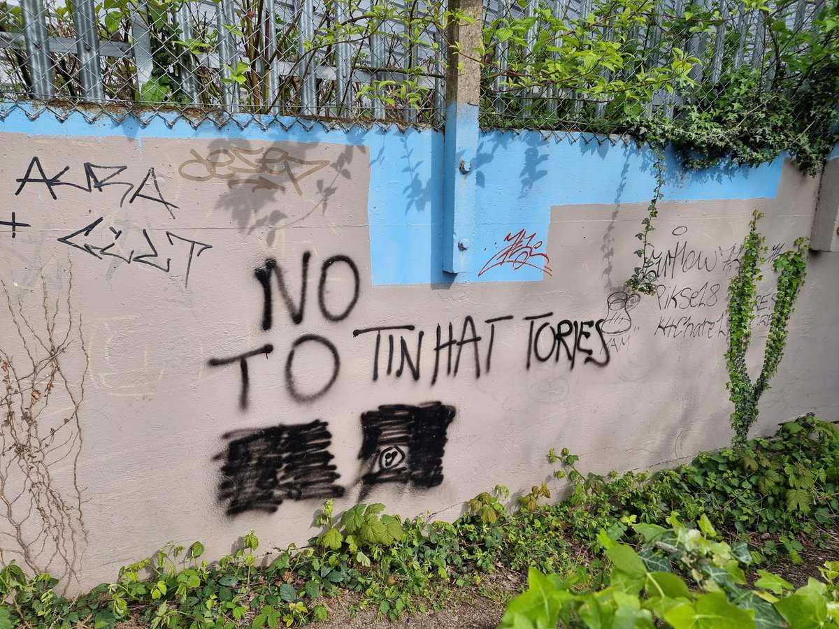 Meanwhile, in Morden Hall Park, beside an electric tram crossing hundreds of metres from drivers, the lawless fringe has now three times (?) sprayed variations on 'NO TO #ULEZ', which have been sprayed over, and the latest time a retort added: 'NO TO TIN HAT TORIES.'