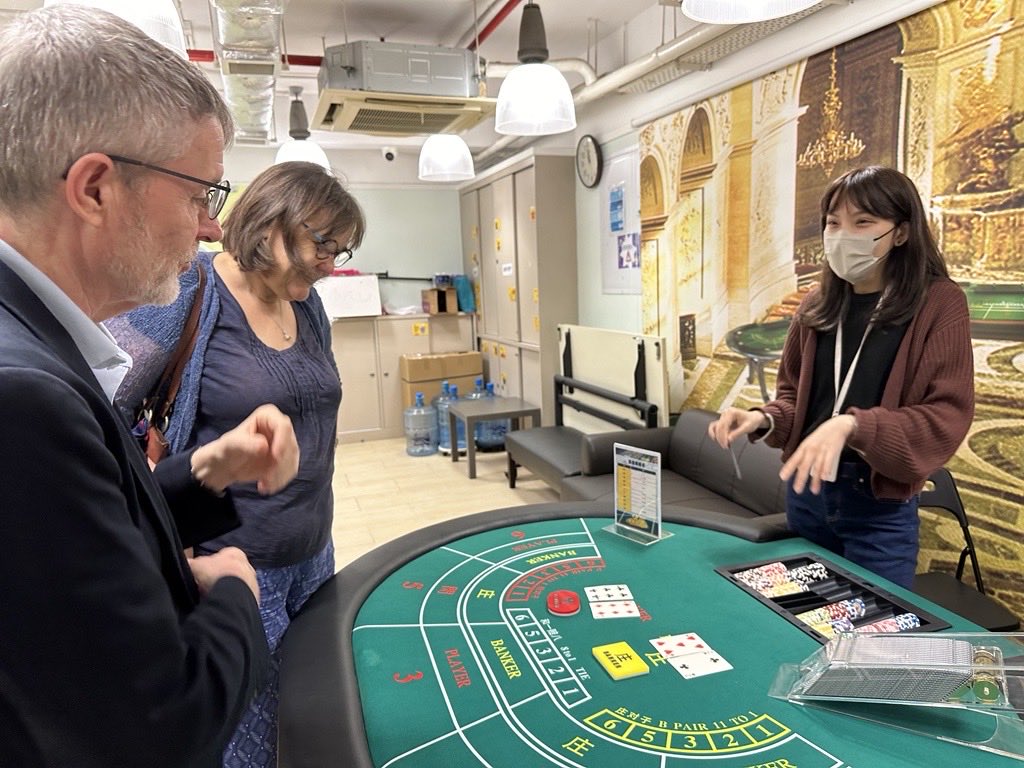 Ada, Emma and MP being talked through how gambling addiction happens…and hooks. Macau HKSKH Social Work Centre.