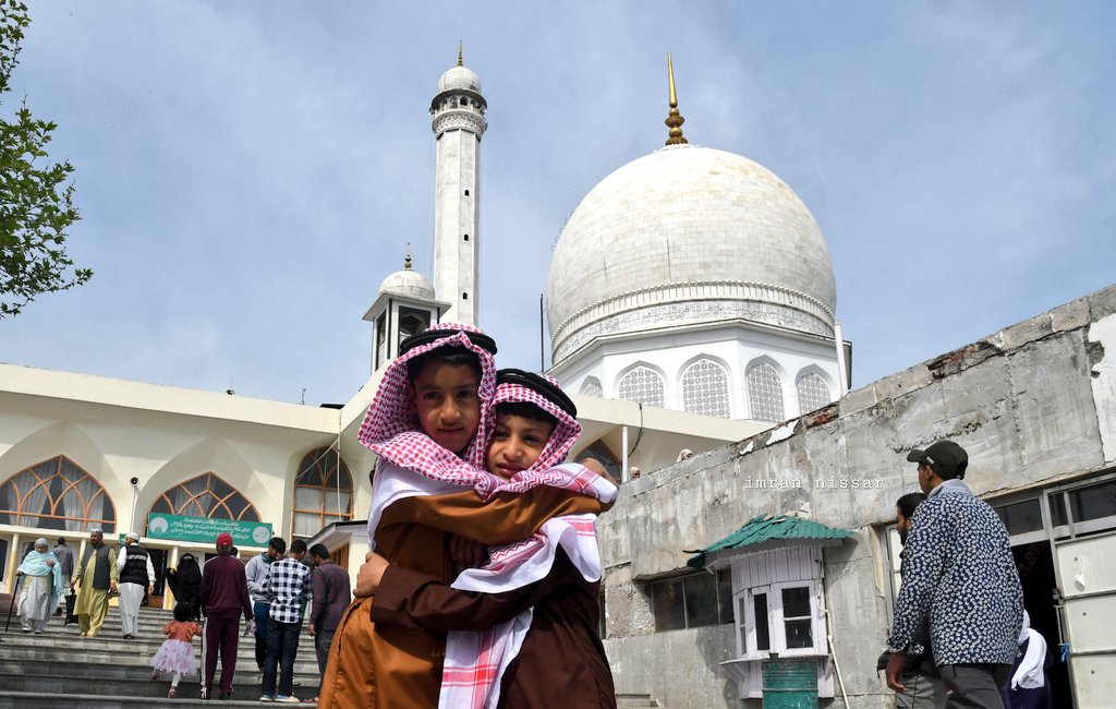 People offer Eid al-Fitr prayers at Hazratbal shrine in Srinagar