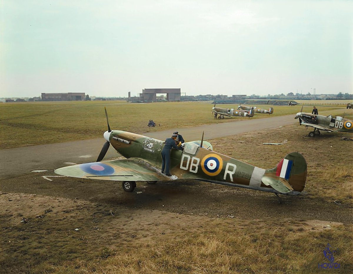 Spitfire of RCAF 411 Squadron, sitting at RAF Digby in July 1941.  Pilot currently unknown, being strapped into this aircraft for a photoshoot by WAAFs. 

Photo: Library & Archives Canada - Ref: PL4918. Image Repair & Colourisation - Nathan Howland @ HowdiColourWorks.