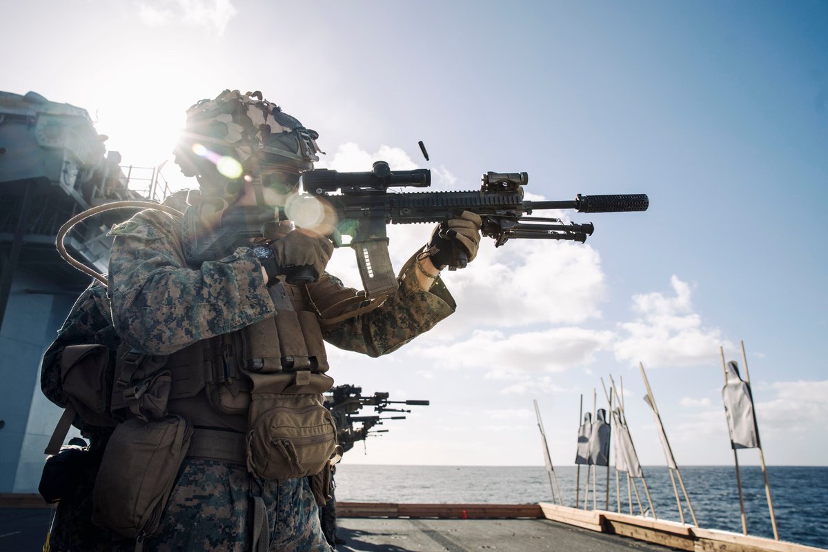 U.S. Marine Corps Lance Cpl. Jack Geels fires an M27 Infantry Automatic Rifle during a live-fire deck shoot aboard the amphibious assault ship USS Boxer … dvidshub.net/r/ib97yc #Marines #Navy