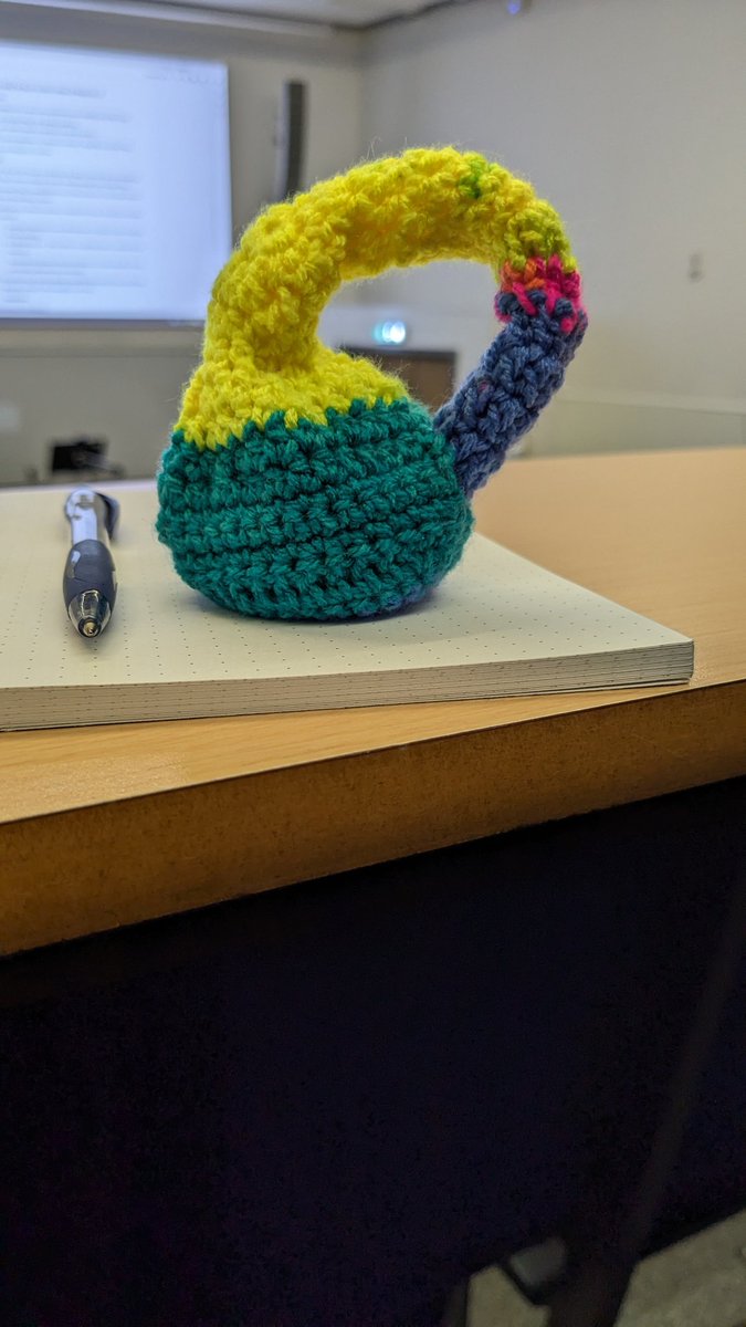 After an emergency trip to a yarn store yesterday*, I now have five squashy and adorable projections of a Klein bottle in 3D crochet. (* I was stupid and didn't bring any project with me to the conference.)