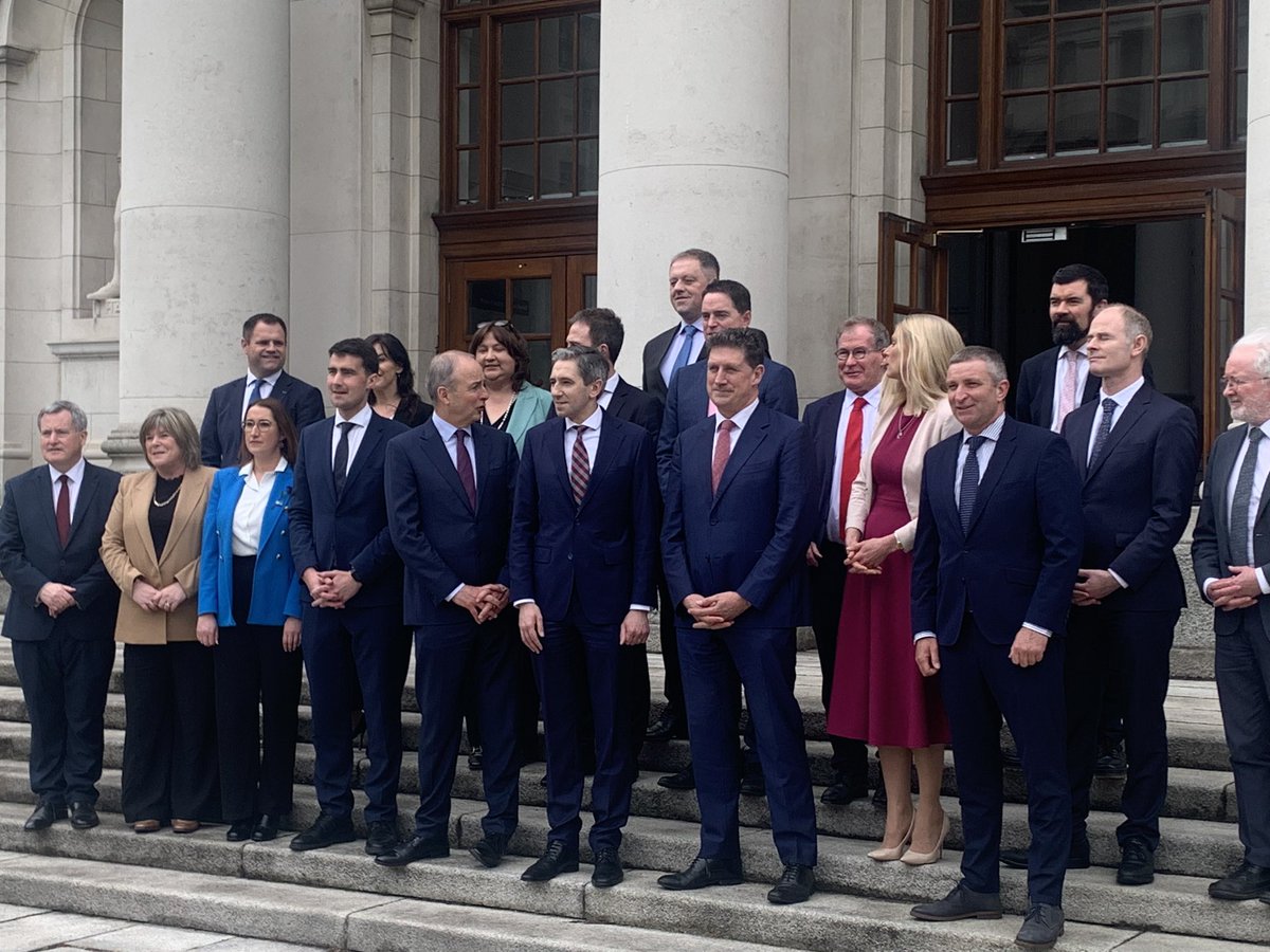 Taoiseach Simon Harris says he has a ‘very good team here’ as he lines up with his junior ministers, the Tanaiste and Minister Eamon Ryan.