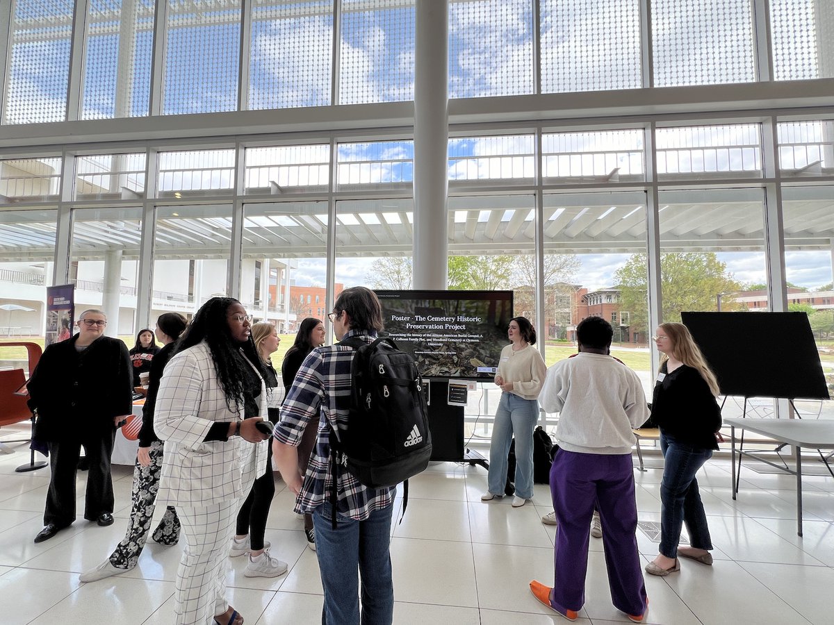 CUCemetery's tweet photo. Last week the students presented their digital poster at the Clemson CI Research Showcase! They discussed their research this semester for the memorial and community engagement for the cemetery project. https://t.co/ZwbqkXmqKl