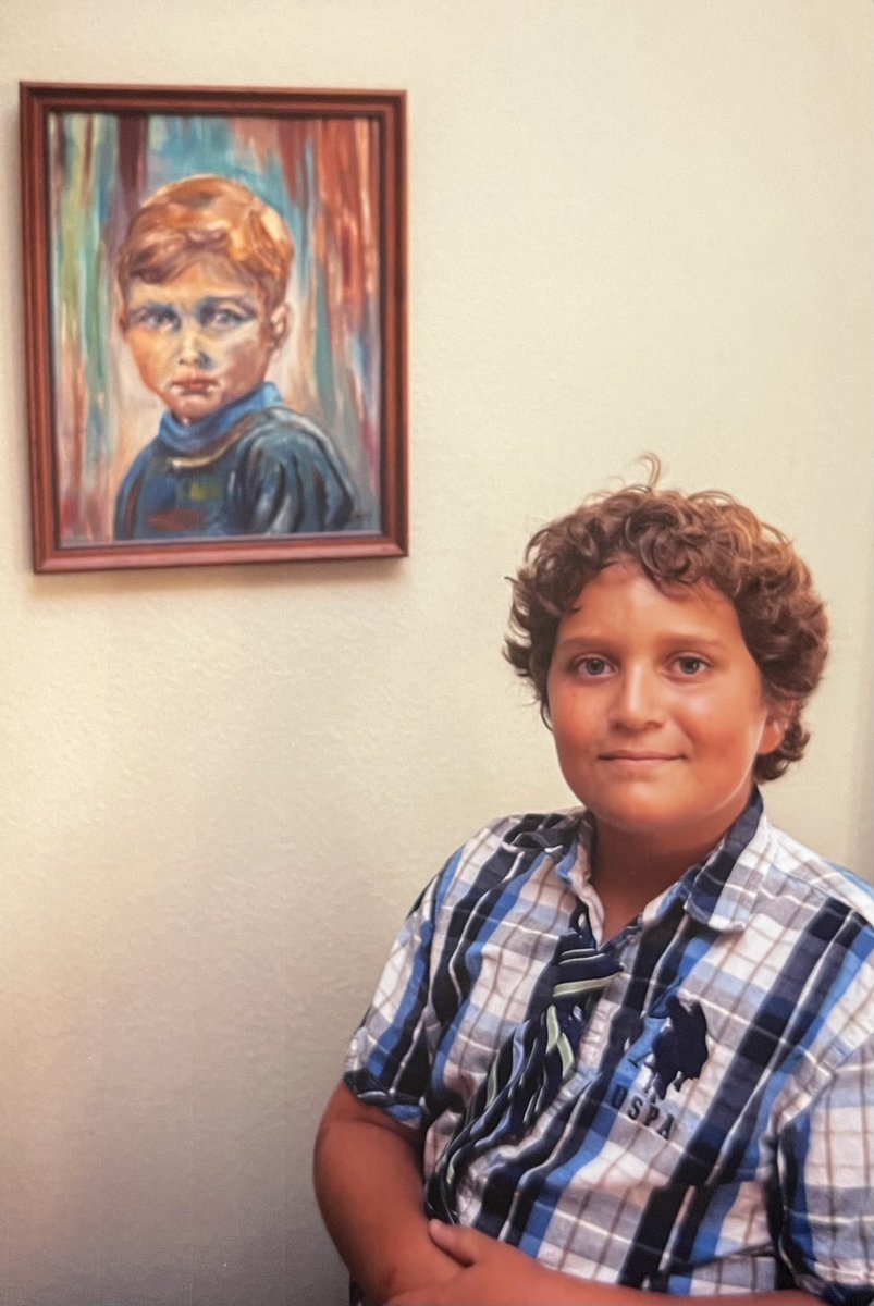 Alex Dunbier, 11-years-old, in front of a painting of his dad Scott Dunbier, painted by his great grandmother Emmy Duenbier, my Omi.