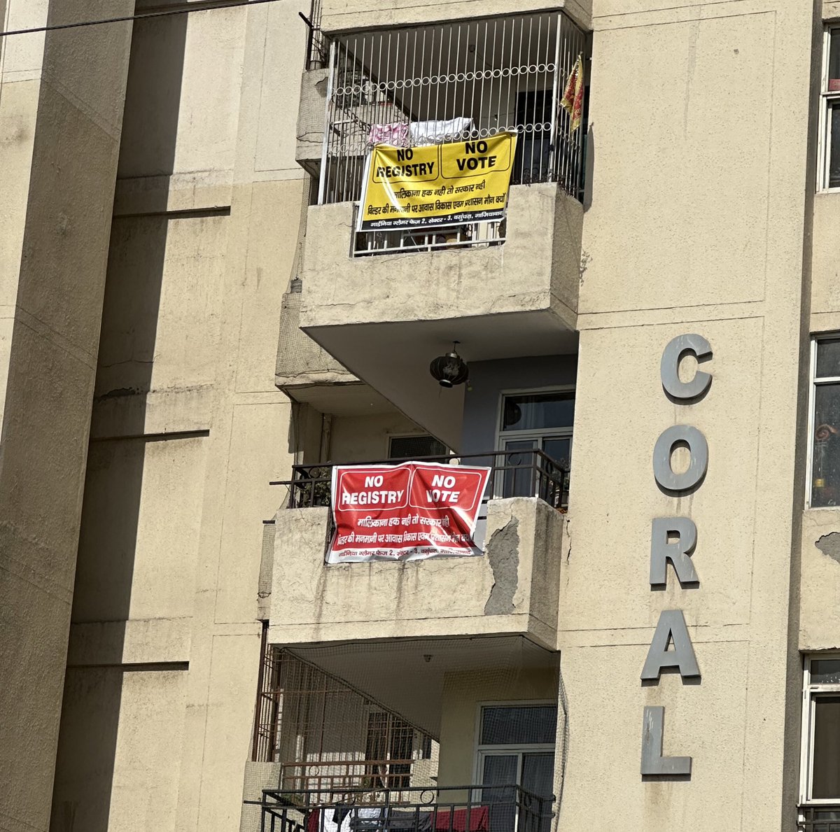 Posters at one of the housing societies in Vasundhara, Ghaziabad. The whole of residents have decided not to vote on Friday in protest against non facilitation of registry of their houses. Residents demand immediate assurance of registry. 

#NoVote