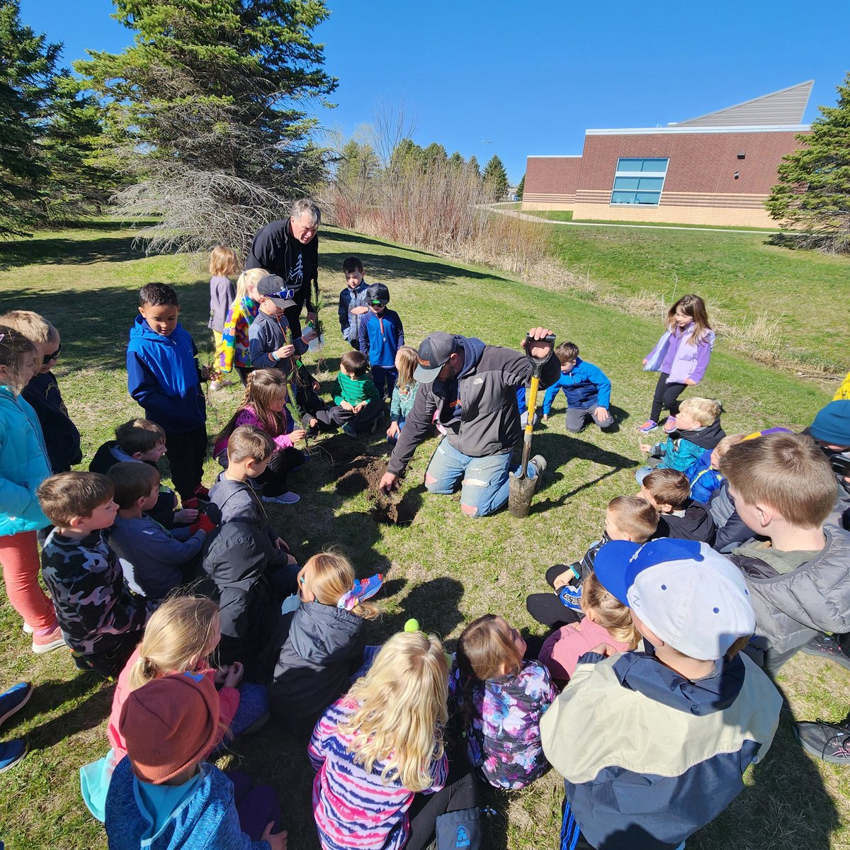 DegroodMegan's tweet photo. This week is all about the nature connections. Earth Day 🌎, Wilderness Wednesday ☀️ and Arbor Day 🌲 We were so fortunate to have Dr. Thompson teach us about trees and plant 6 white spruce in our nature space. 
#bestsuperintendentever #NBK #plantingandgrowing #PLTWconnections https://t.co/Mj8wYPSLFi