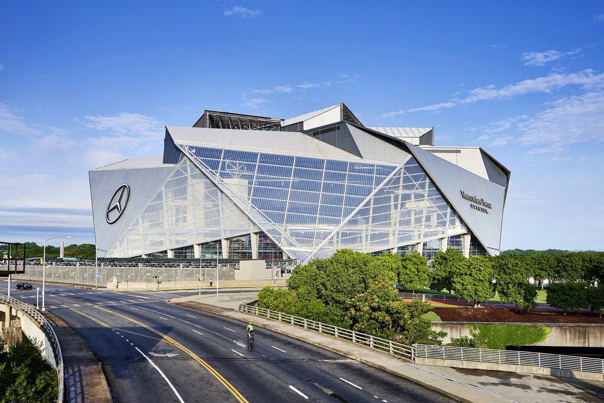 apurv_anand's tweet photo. Mercedes-Benz Stadium is considered one of the most technologically advanced stadiums in the world, with 4,800 miles of fiber optic cable, 1,800 wi-fi access points, and the world's largest digital display, the Halo Board. It also has wide concourses, escalators, elevators, and two Sky bridges to help you navigate the stadium. 
The stadium is also known for its sustainability features, including:
Energy
Uses 29% less energy than a typical stadium, and generates 6 million kilowatt hours of renewable energy every year from its 4,000 solar panels
Water
Uses 47% less water than standard venues, and has a 680,000-gallon cistern that collects rainwater for irrigation
Stormwater
Has a 1.1 million gallon underground water vault that captures stormwater and slowly releases it to prevent floods 
The stadium also has a retractable roof with eight translucent, triangular panels that create the illusion of bird's wings when opened.

The stadium has over 20,000 parking spaces within a 20-minute walk, but parking often sells out before an event. Some recommend pre-purchasing a parking pass, and others recommend getting tickets in advance. Some say the parking setup is haphazard and the streets around it are congested, making it difficult to get in and out.