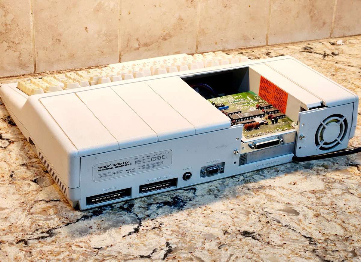 NYVintageMicros's tweet image. I rescued this Tandy 1000 HX  from ewaste, but the cable was clipped, keys knocked off, and cover lost. My friend Ian fixed it. Just need a cover now.

The HX released in 84', with DOS 2.11 stored in a ROM, 640k RAM, 16 color display, and 3 voice sound. 

#Tandy1000
#Radioshack
