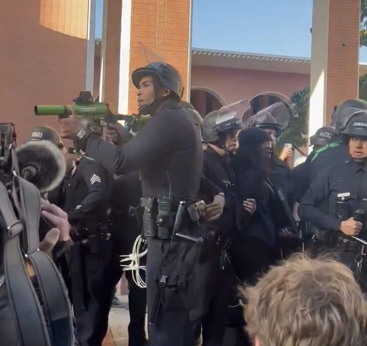 hearinladotcom's tweet image. Jumpy LAPD officer aims rubber bullet weapon at unarmed USC students after water is tossed in his direction
--
I don't want to swear it
But it's something that I've heard
A gun in the first act
Always goes off in the third

- @ThePeterCase 
from "Put Down the Gun"