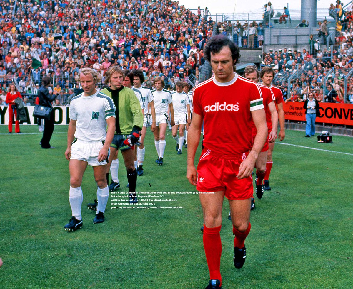 Berti Vogts (Borussia Mönchengladbach) and Franz Beckenbauer (Bayern München) walk in Mönchengladbach vs Bayern München 4-1 at Bökelbergstadion att:34,500 in Mönchengladbach, West Germany on Sat. 20 Sep 1975 photo by Masahide Tomikoshi/TOMIKOSHI PHOTOGRAPHY