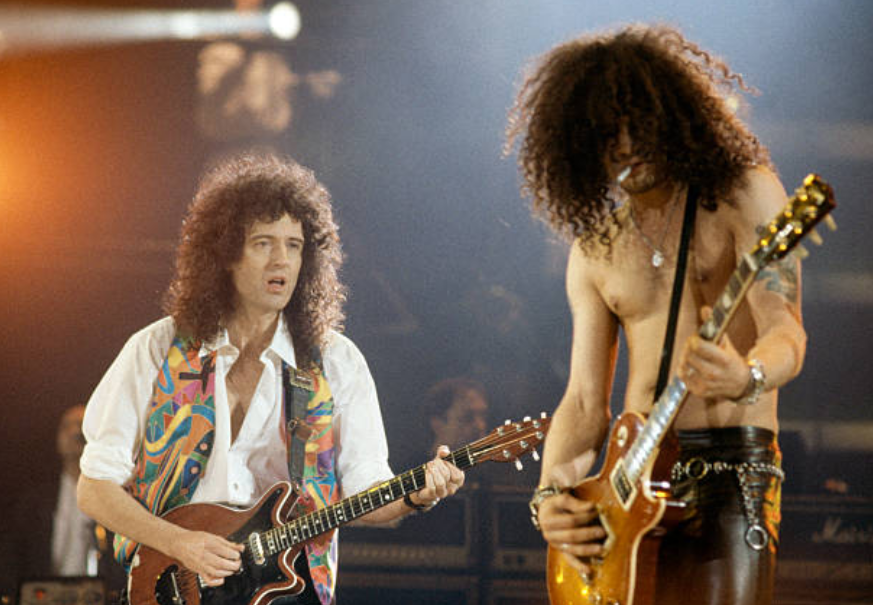 Brian May & Slash at the Freddie Mercury Tribute Concert for Aids Awareness at Wembley Stadium in London, 1992. Photo by Jim Steele.