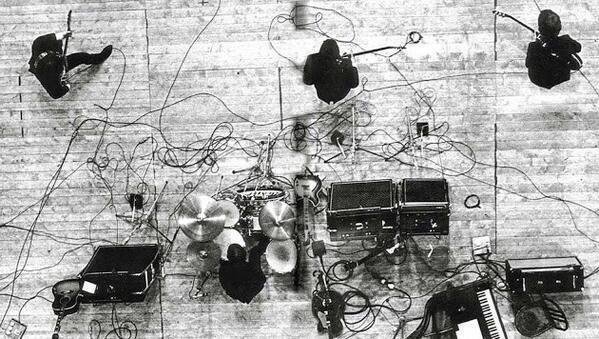 Overhead view of The Beatles performing in Paris, 1965