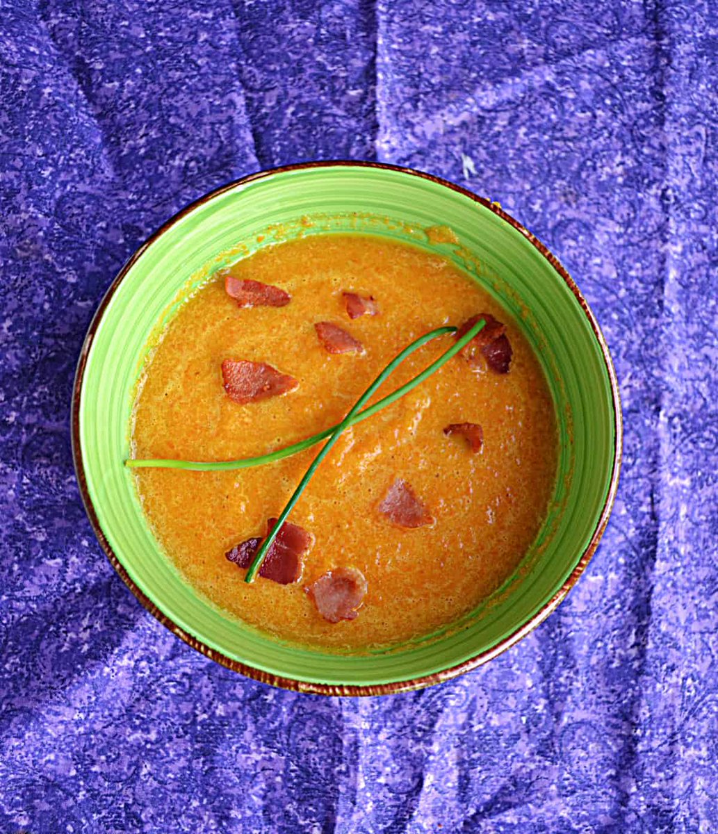 Creamy Carrot Soup is a quick and easy soup recipe with a silky smooth texture that is topped off with crispy bacon. #carrots #soup #carrotsoup #spring hezzi-dsbooksandcooks.com/creamy-carrot-…