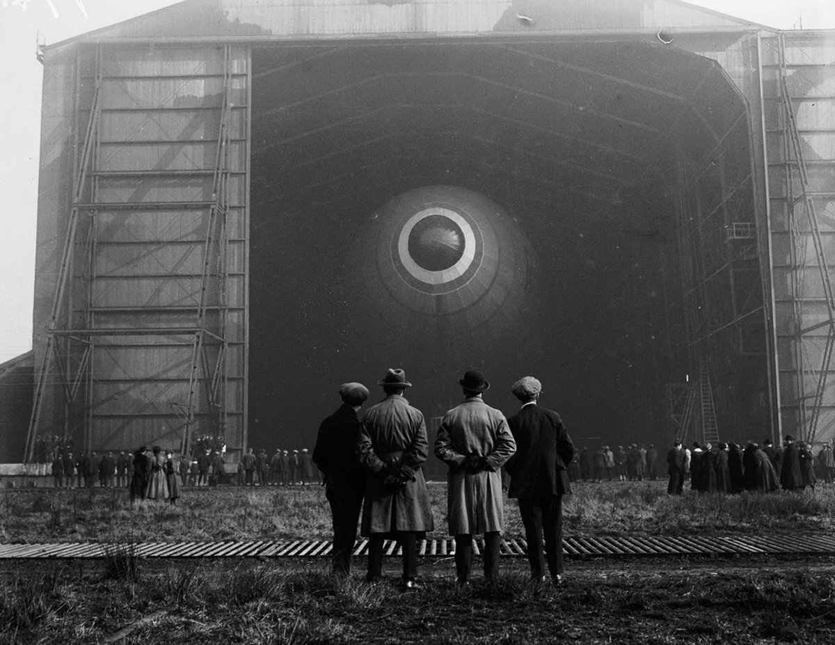 The British airship R33 in its hangar as it prepares for its first-ever flight at an aerodrome in Barlow, Yorkshire. 1919.