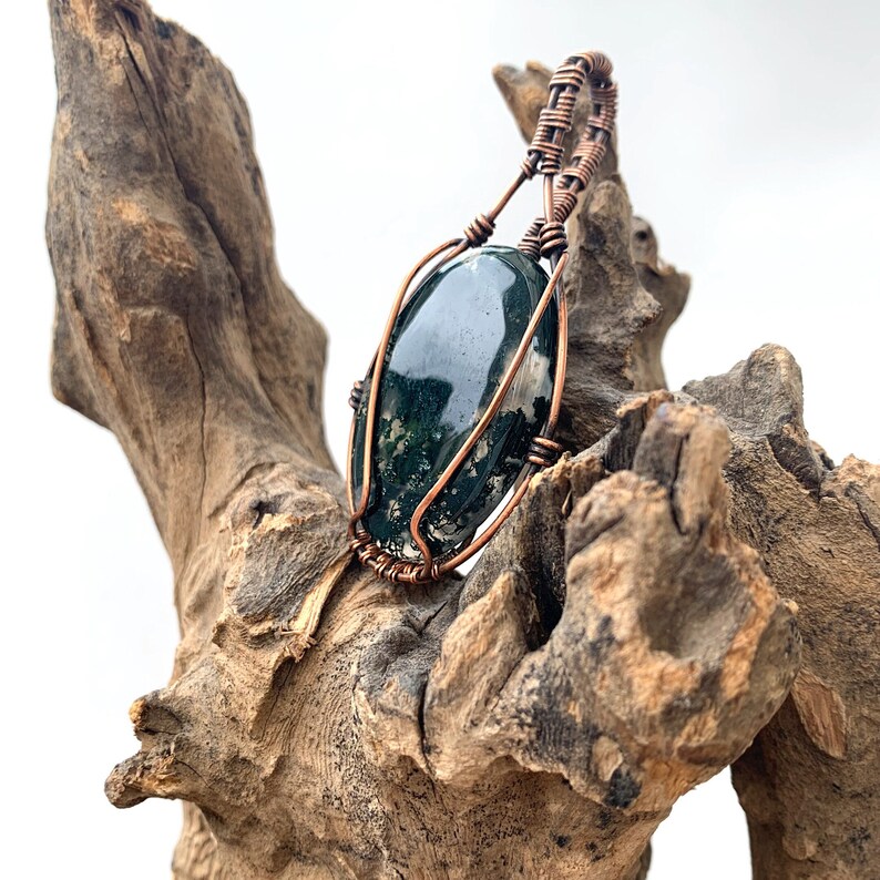 From £18.00 via Etsy, Moss Agate Pendant Wire Wrapped Copper Oval, Optional Chain/ Cord: etsy.com/uk/listing/170…

#mossagate #copper #copperwirewrapped #handcrafted #uniquependant #boholook #bohostyle #originaljewellery #wirewrapped #wirewrappedjewellery #bohemianpendant #pendant