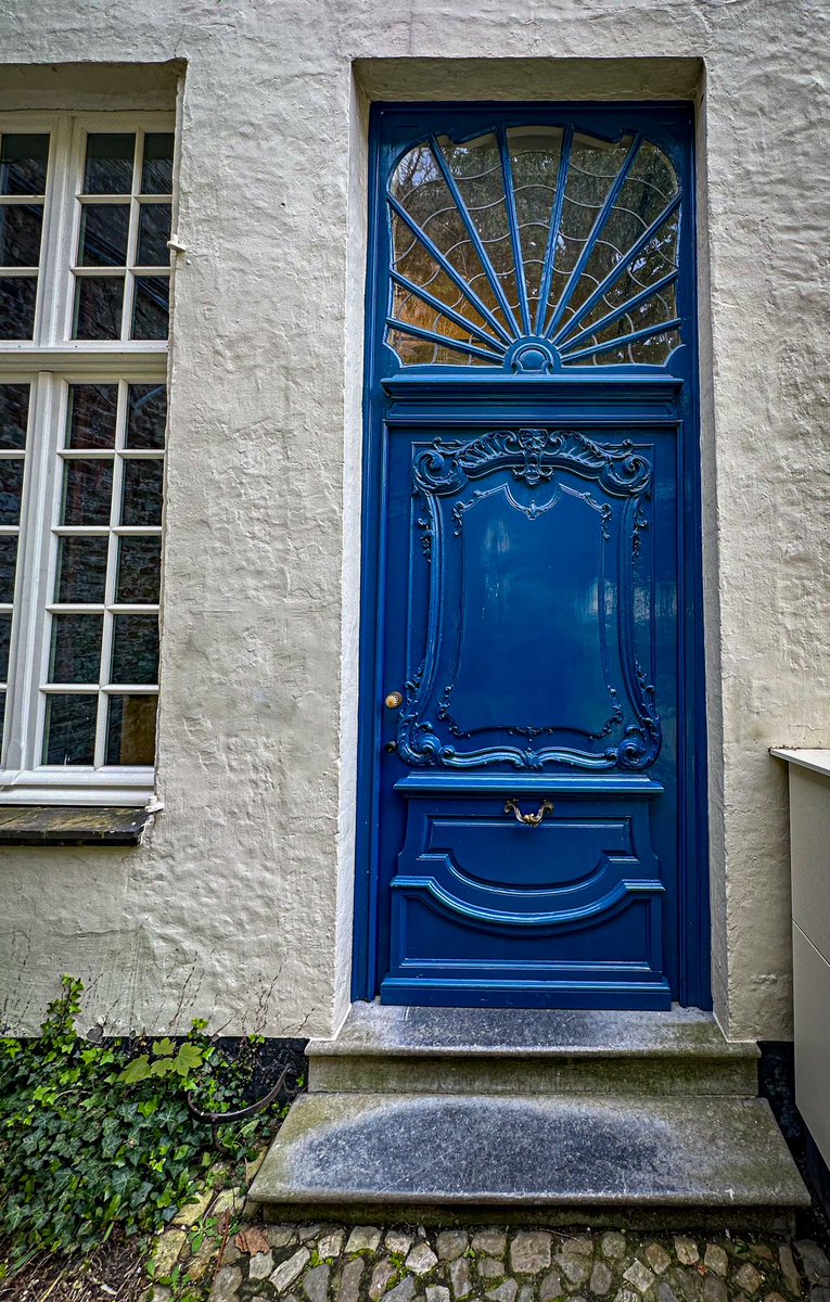 Gleaming blue, spider web light: Bruges, Belgium #DailyDoor