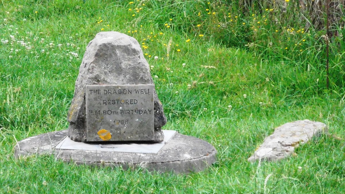 The Dragon Well at Brinsop, Herefordshire, where the stone marks the spot on which St George killed the dragon, in the field just beyond the church wall. Not exactly eye-catching but all part of the tradition.