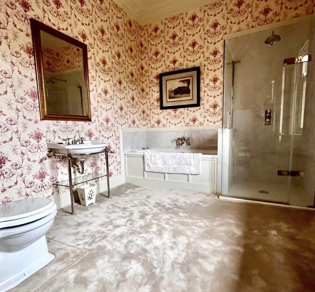 A beautiful traditional bathroom by <a href="/Ripon_Interiors/">Ripon Interiors</a>. 

The stunning wallpaper, statement basin and wall art make this a unique space. Our Invincible Collection brassware complements the design and is perfect for a period home. Polished Nickel finish adds an extra touch of style.