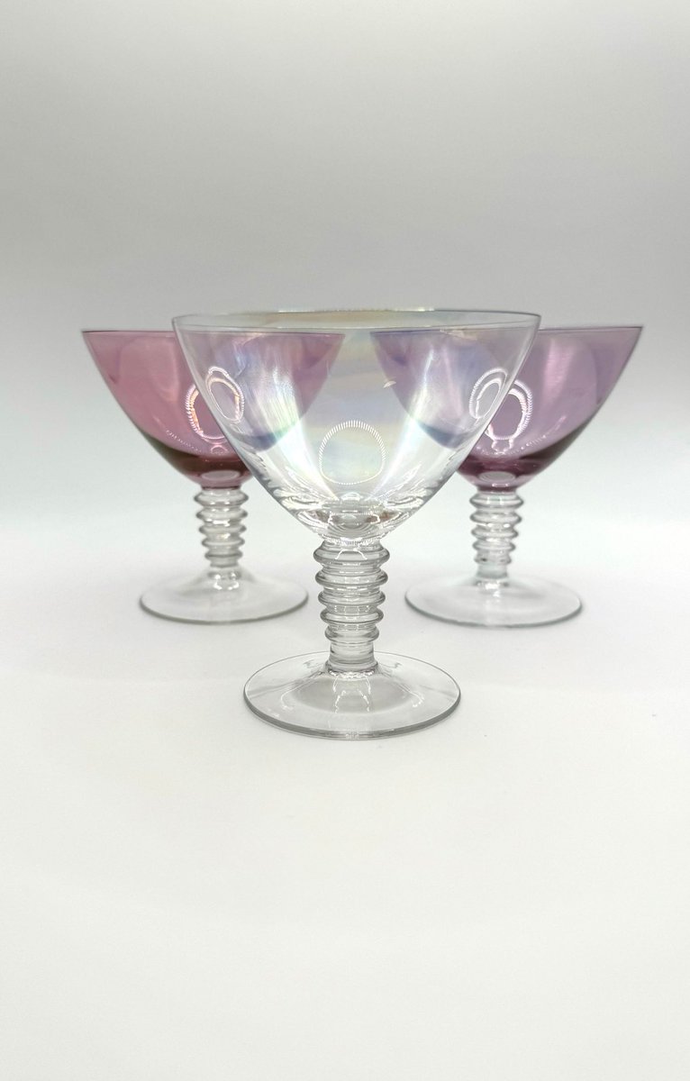 How stunning and exquisite are these handmade pearlised #cocktailglasses. They are wide rimmed cocktail slim glasses with a fabulous pearlescent pink, lilac or pearl bowl and clear glass stem with rivets. lilfordvintage.etsy.com/listing/171878… #vintage #glassware #barware #lilfordvintage #etsy